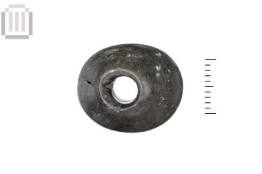 Stone spindle whorl or bead from Doliani