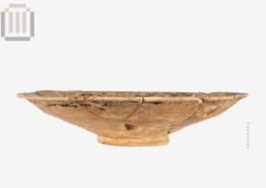 Clay black glazed omphalos plate from Karvounari