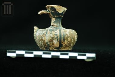 Small black glazed squat lekythos
