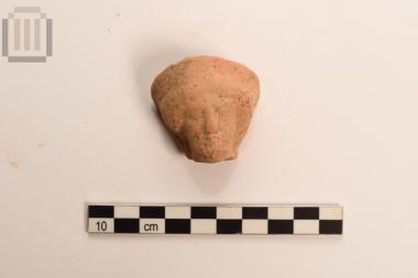 Head of clay female figurine