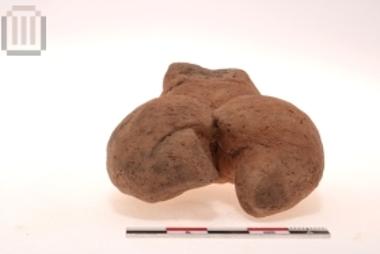 Part of clay female figurine