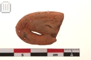 Part of clay male figurine