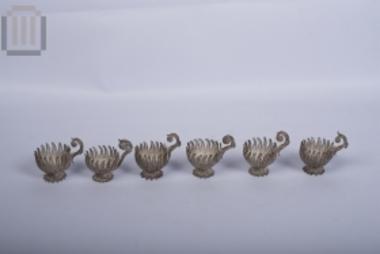 Six silver cup bases with handle