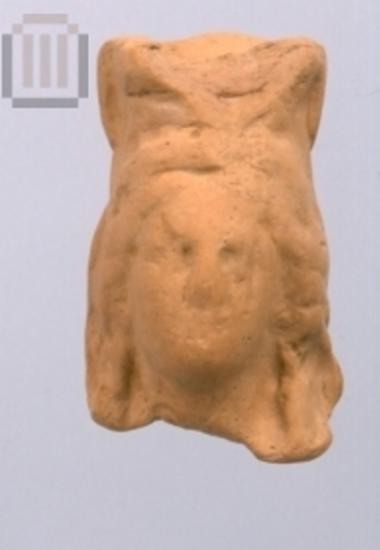 Part of a clay female figurine from Riziani