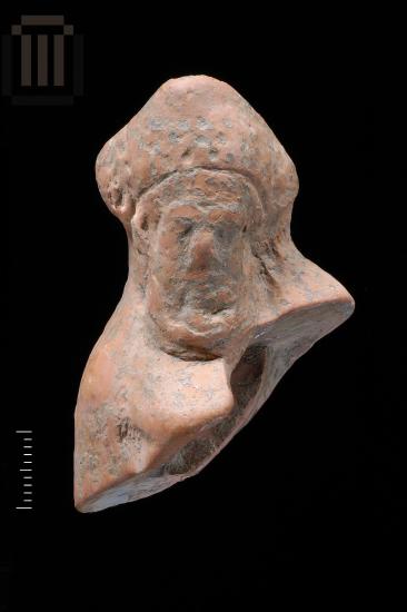 Part of a clay male figurine from Kyra Panagia