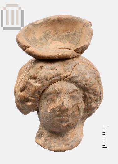 Head of clay female figurine from Kyra Panagia