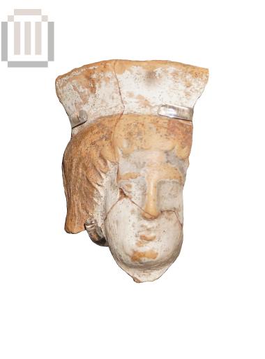 Head of female clay-figurine with polos