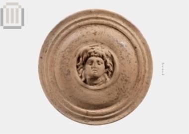 Part of a clay pyxis lid from Gitana