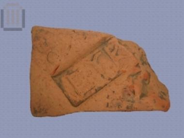 Fragment of stamped roof tile