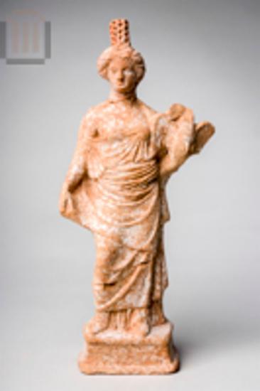 Female figurine holding a swan