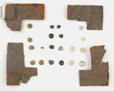 Iron sheets from the revetment of a wooden folded gaming board for the play of board game