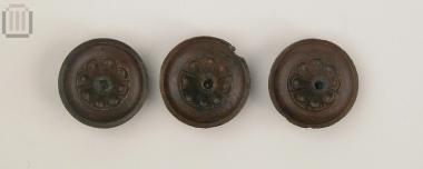 Three bronze horse bridle strap junction fittings (phalara)
