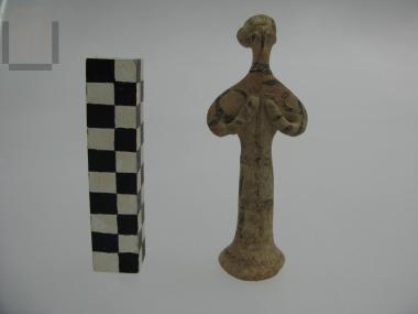 Clay phi type figurine