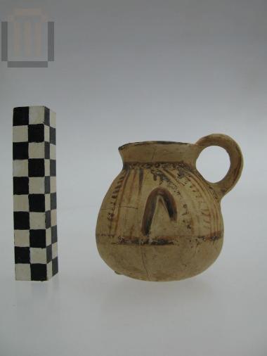 Miniature clay jug