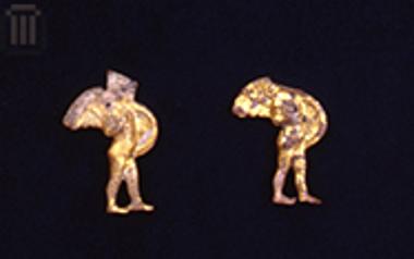 Two gilded terracotta cut-out plaques with Cupids from a diadem