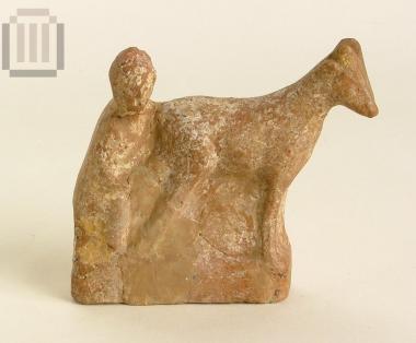 Terracotta figurine of a man milking a goat