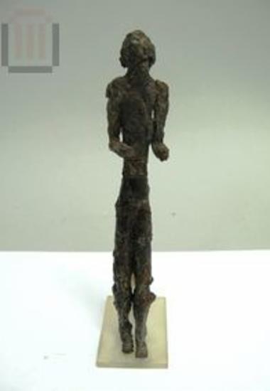 Iron kouros figurine