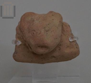 Fragment of a rim with relief decoration