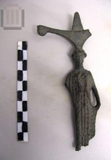 Bronze reflector handle in shape of peplophoros