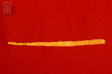 Gold banded sheet from the decoration of a sword's baldric