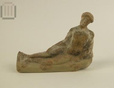 Terracotta figurine of a reclined girl