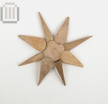 Bone eight-petalled rosette from the inlaid decoration of the lid of a wooden pyxis