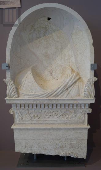 Inscribed funerary stele with a palmette crowning