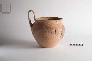 One-handled incised vase
