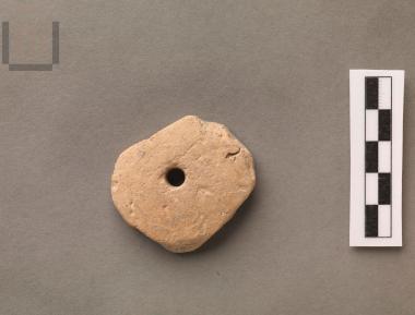 Round perforated sherd disk