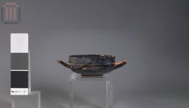Black painted no footed kylix/cup
