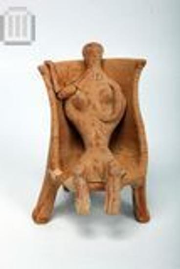 Figurine of female seated