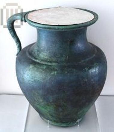 Bronze burial jug with lead discoid lid