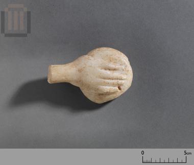 Hand of a small marble statue with a phiale
