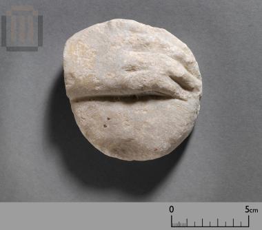 Hand of a small marble statue with a phiale