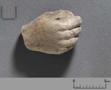 Hand of a small marble statue