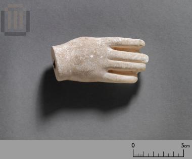 Hand of a small marble statue