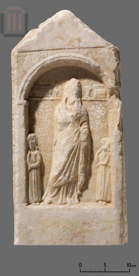 Inscribed marble funerary stele with a relief scene