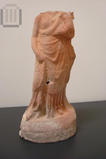 Terracotta figurine of a female figure with Eros