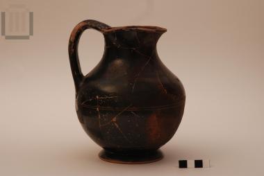 Black painted trefoil-mouthed jug