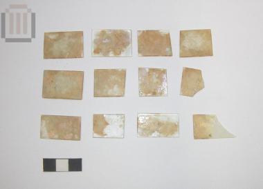 Twelve rectangular glass inlays from the decoration of a wooden kline