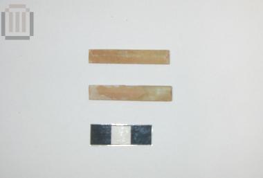Two oblong glass inlays from the decoration of a wooden kline