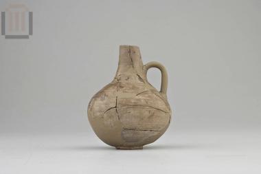 Clay jug with cutaway neck