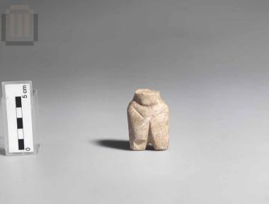 Part of a marble figurine of a female figure