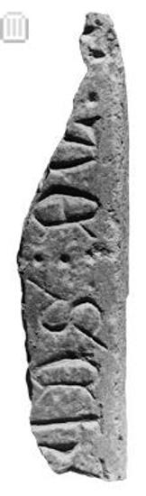 Fragment of an inscribed tomb slab