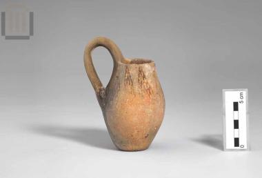 Clay juglet with horizontal rim and a raised, banded handle