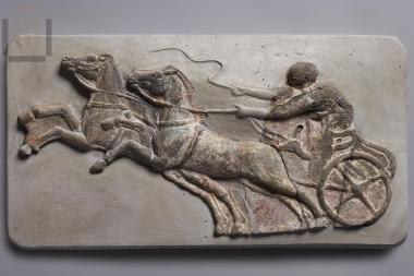 Clay relief applique with two-wheeled chariot (synoris) from the decoration of a kline