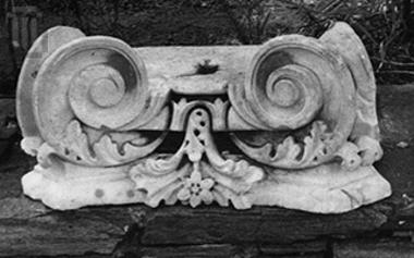 Half-column capital