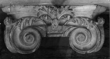 Half-column capital