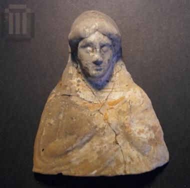 Clay bust of a female figure