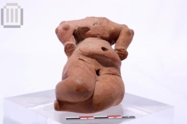 Clay seated female figurine